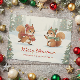 Verspielte Eichhörnchen im Weihnachts-Winterwald Feiertagskarte
