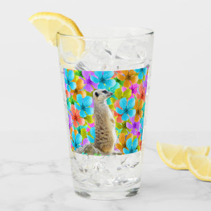 Verspielter Garten: Meerkat Amid Tribfarbene Blüte Glas