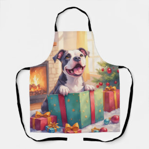 Verspielter Pitbull öffnet Weihnachtsgeschenke Fei Schürze