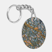 Versteinerter Dinosaurier-Knochen Schlüsselanhänger (Vorderseite links)