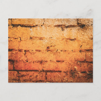 Verwitterte orange Ziegelwand Postkarte
