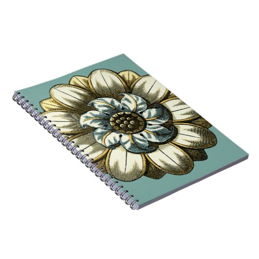 Verzierte Blumenmedaille über hellblauen Hintergru Notizblock (Rechte Seite)