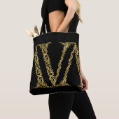 Verziertes Gold V Monogram Erstdesign auf einer be Tasche (Von Nahem)