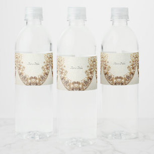 Verziertes goldenes Wasserflaschenetikett mit Schn