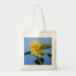 Vibrierende gelbe Sonnenblume-Blumen im blauen Tragetasche