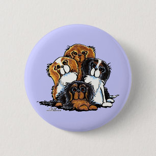 Vier Kavalier-König Charles Spaniels Button