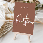 Vierzehn handgescripte Tabelle Tischnummer<br><div class="desc">Einfache und schicke Tischnummer-Karten im Erdton Rost braun und Weiß machen eine elegante Aussage bei Ihrer Hochzeit oder Veranstaltung. Das Design bietet "table [number]" in einem spannenden Mix aus klassischen Serifen und handgeschriebenen Skripten. Design wiederholt sich auf beiden Seiten. Einzelne nummerierte Karten werden separat verkauft; bestellen Sie jede Tischnummer einzeln...</div>