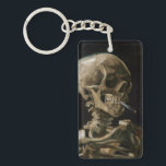 Vincent van Gogh Art Schlüsselanhänger<br><div class="desc">Vincent van Gogh (Niederländisch, 1853 - 1890) Schädel eines Skeletts mit brennender Zigarette, 1885-86, Öl auf Leinwand Ungerahmt: 32 cm × 24, 5 cm (13 in × 9, 6 in) Früharbeit von Vincent van Gogh. Dieses kleine Gemälde ist Teil der ständigen Sammlung des Van Gogh Museums in Amsterdam. Es wurde...</div>