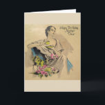 Vintag - Happy Birthday Mother Karte<br><div class="desc">Eine Vintage Geburtstagskarte für eine Mutter bietet eine raffinierte und modische Dame, die sich mit einer Tasse Tee oder Kaffee entspannen kann. Neben ihr auf einem Tisch sind ein paar rosa Rosen. Auf der Vorderseite der Karte steht "Happy Birthday Mother Dear" und die Meldung in der Karte lautet: "Eine besondere...</div>