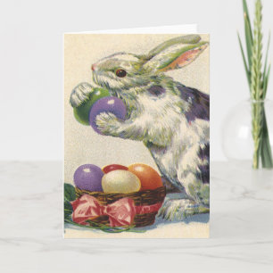 Vintag Osterhase mit Ostereiern im Korb Feiertagskarte