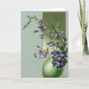Vintage blühende violette Blumen in einem Osterei Feiertagskarte