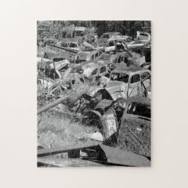 Vintage cars rusting away in a car yard puzzle