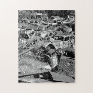 Vintage cars rusting away in a car yard puzzle