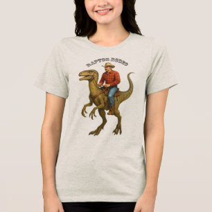 Vintage Cowboy reitet auf einem Velociraptor-Dinos Tri-Blend Shirt