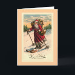 Vintage französische Karte "Santa on Skis"<br><div class="desc">Entworfen von Susan Epps Oliver. Vintages französisches Bild mit dem Weihnachtsmann auf den Skiern. Er sieht sehr glücklich aus,  einen Berg mit einem Obstkorb auf seinem Arm und einem Sack Spielzeug auf seinem Rücken hinunter zu fahren.</div>