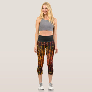 Vintage gestreifter Halbmond schwarz orange gold Capri Leggings