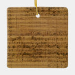 Vintage Noten von Johann Sebastian Bach Keramikornament<br><div class="desc">Vintages Illustrationsmusikalisches Design mit Notenblatt Cantata 112 Manuskript,  1731 von Johann Sebastian Bach (1685-1750). Eine Kantate ist eine stimmliche Komposition mit instrumentaler Begleitung,  meist in mehreren Bewegungen,  oft mit einem Chor. Antike klassische Noten mit Symbolen inklusive einem dreieckigen Klettstück.</div>