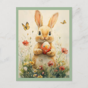 Vintage-Osterhase mit Ei in Wildblumen Feiertagspostkarte