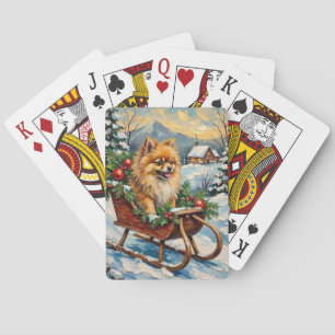 Vintage-Pomeranian in hölzernem Weihnachtsschlitte Spielkarten