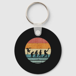 Vintage Retro-Evolution eines Cricket-Spieler-Silh Schlüsselanhänger