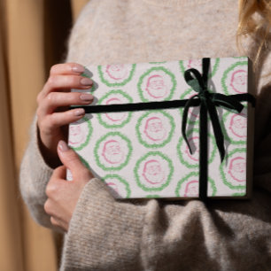 Vintage rosa Weihnachtsmann umrahmt von einem grün Geschenkpapier