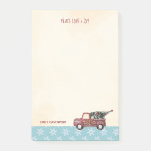 Vintage roter Spielzeug-LKW mit einem Weihnachtsba Post-it Klebezettel