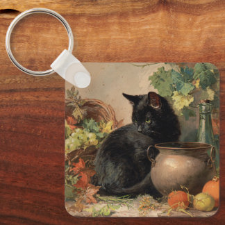 Vintage schwarze Katze im Herbst Früchte Schlüsselanhänger