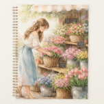 Vintage Watercolor Flower Market Girl Planner Note Planer<br><div class="desc">This beautiful planner notebook features a soft watercolor illustration of a girl at a charming flower market surrounded by colorful blooming flowers. The delicate floral artwork and vintage aesthetic create a calm and inspiring space for planning your daily tasks. Perfect for organizing your schedule, writing to-do lists, planning goals, journaling,...</div>