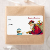 Vintager Weihnachtsmann und Kindergeschenk-Tag (Insitu)