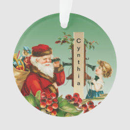 Vintager Weihnachtsmann und Mädchen am Telefon mit Ornament