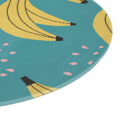 Vintages Bananenmuster, blauer Hintergrund. Schneidebrett (Ecke)
