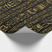 Vintages Gold der ägyptischen Hieroglyphen auf Geschenkpapier (Ecke)