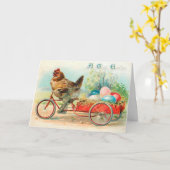 Vintages Osterhühnchen Reiten eines Fahrrad Ostere Karte (Gelbe Blume)