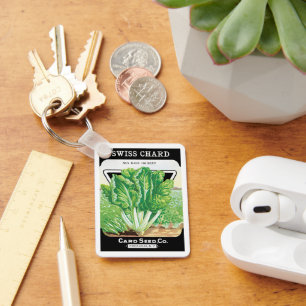 Vintages Saatgutverpackungs-Label Kunst, Schweiz S Schlüsselanhänger