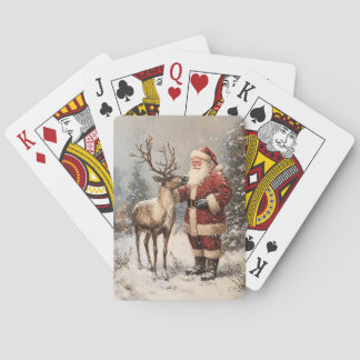 Vintages Santa Petting einer Rentiermalerei Spielkarten