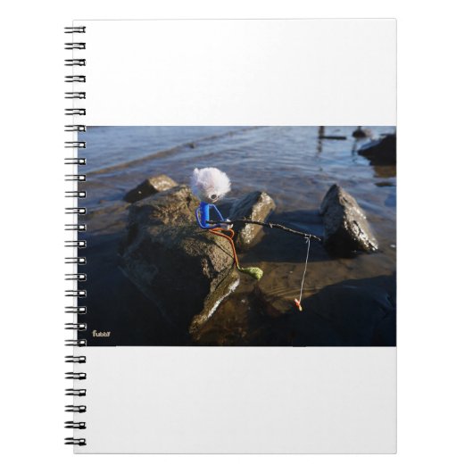 Vissende Fubby op een steen. Notizblock (Vorderseite)