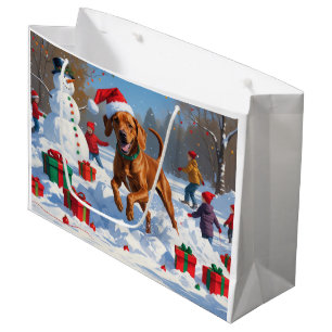Vizsla läuft im Schnee mit Weihnachtsmütze Große Geschenktüte