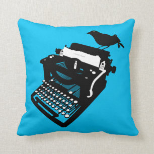 Vogel auf einem Schreibmaschinen-Kissen (blauer Kissen