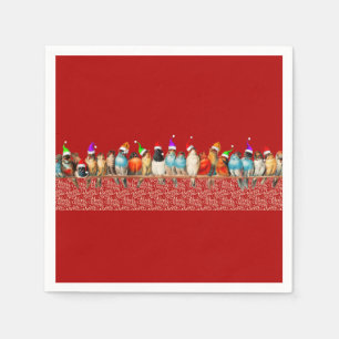 Vögel, die Weihnachtsmannmützen tragen Serviette