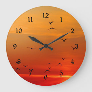 Vögel erheben sich bei Sonnenuntergang, malerische Große Wanduhr