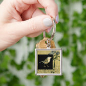 Vogel im schwarzen und Vintagen Hintergrund Schlüsselanhänger (Hand)