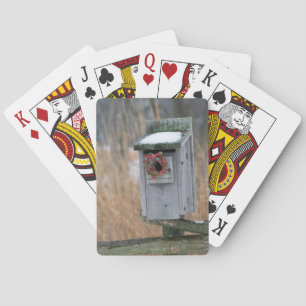 Vogel, Nistkasten mit Weihnachtsgirlande im Winter Spielkarten
