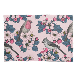 Vögel und Blüten auf rosa Kissenbezug