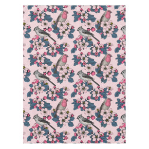 Vögel und Blüten auf rosa Tischdecke