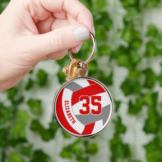 Volleyball-Team gibt rot-graue Schulfarben Schlüsselanhänger (Hand)