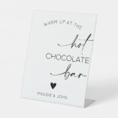Wärmen Sie an der heißen Schokolade auf Sockelschild (Vorderseite)