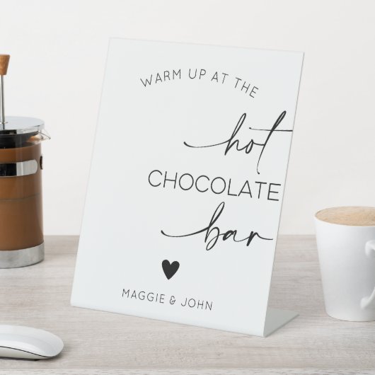 Wärmen Sie an der heißen Schokolade auf Sockelschild (In SItu)