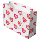 Warmes rosa Orangefarbenes Herzmuster Große Geschenktüte (Rückseite Schrägansicht)