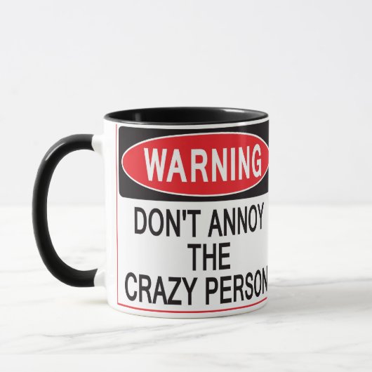 warnende Tasse der verrückten Person (Links)