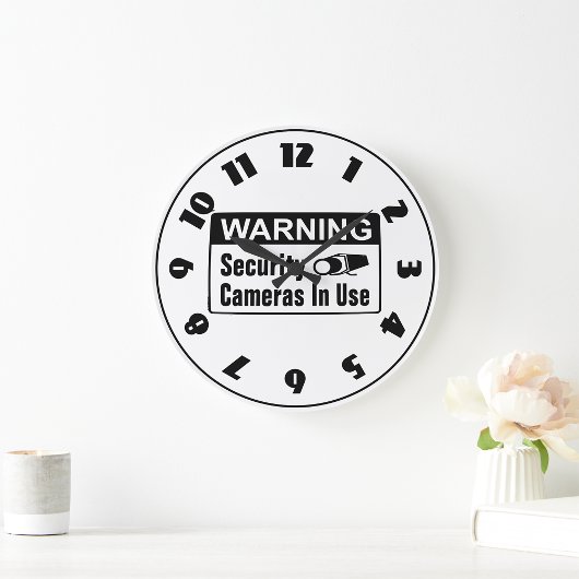 Warnung vor einer Sicherheitskamera in der verwend Große Wanduhr